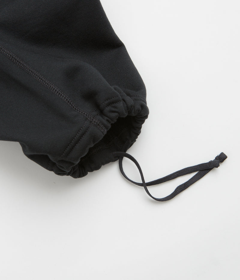 Nike Solo Swoosh Open Hem Sweatpants in Black and Black / White