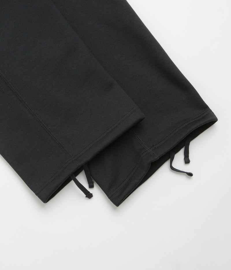 Nike Solo Swoosh Open Hem Sweatpants in Black and Black / White