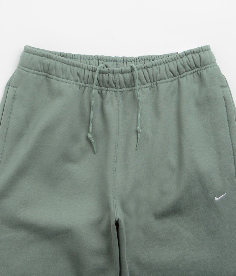Nike Solo Swoosh Open Hem Sweatpants in Clay Green and Clay Green / White