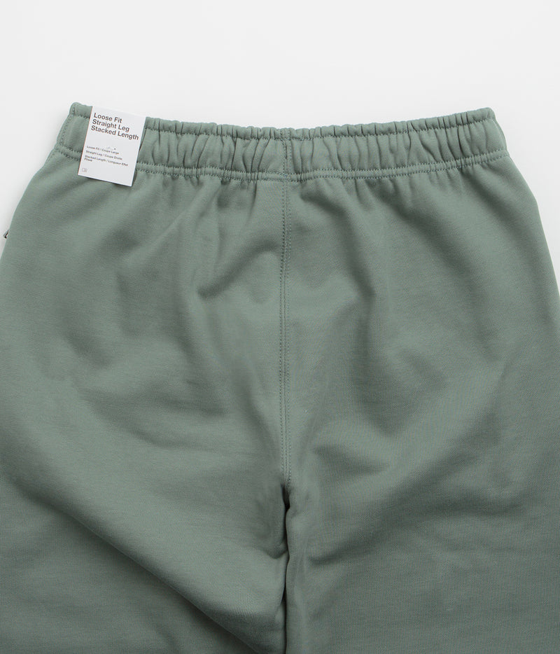 Nike Solo Swoosh Open Hem Sweatpants in Clay Green and Clay Green / White
