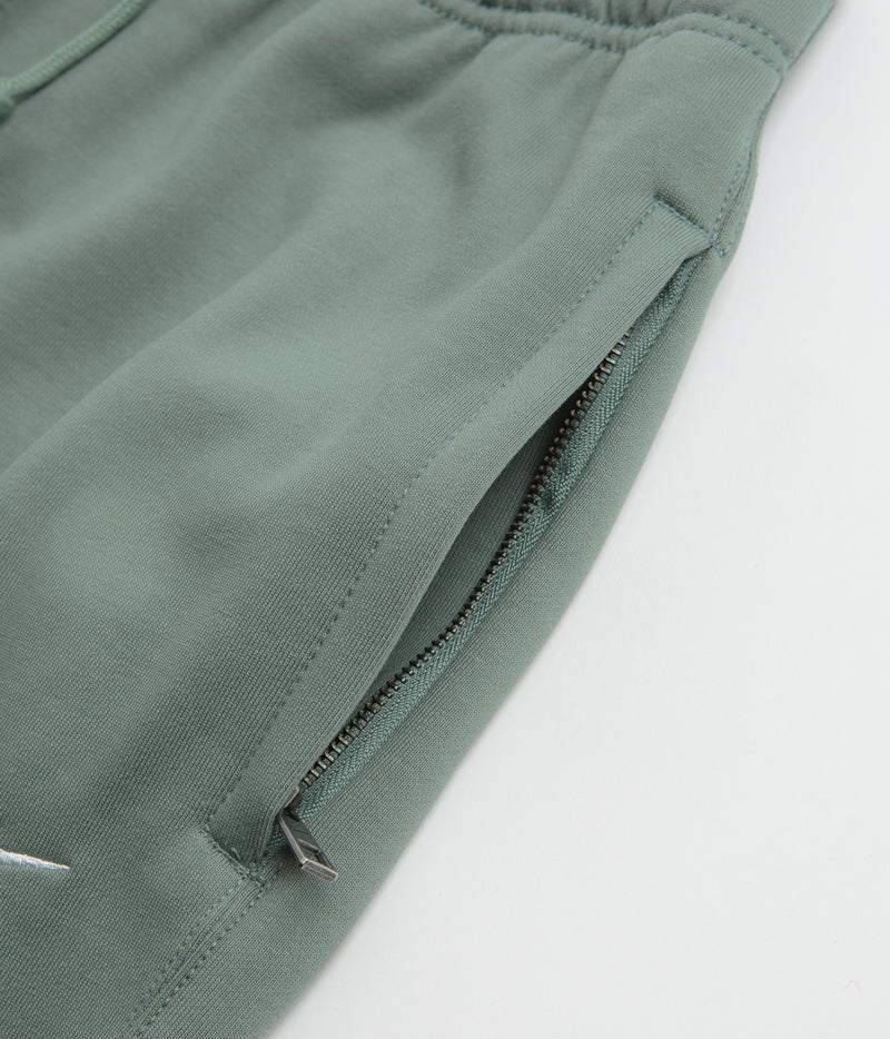 Nike Solo Swoosh Open Hem Sweatpants in Clay Green and Clay Green / White