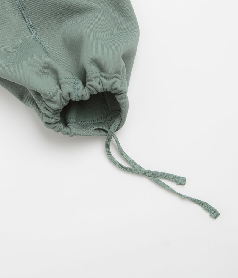 Nike Solo Swoosh Open Hem Sweatpants in Clay Green and Clay Green / White