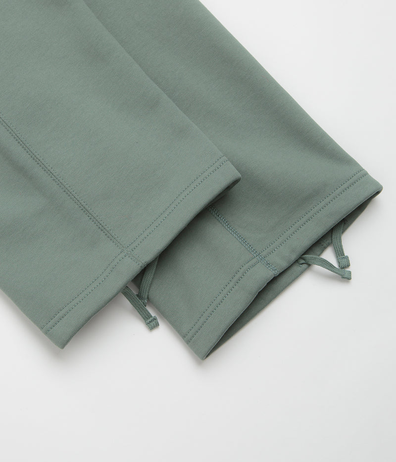 Nike Solo Swoosh Open Hem Sweatpants in Clay Green and Clay Green / White