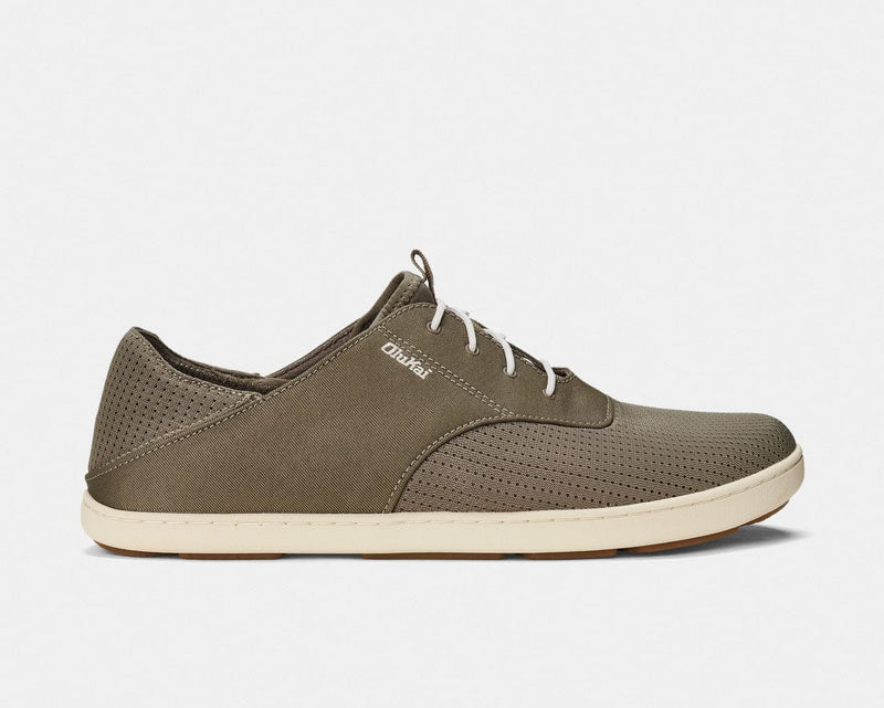 OluKai Nohea Moku shoes in dark olive green with breathable mesh upper, white laces, and tan sole, side view.