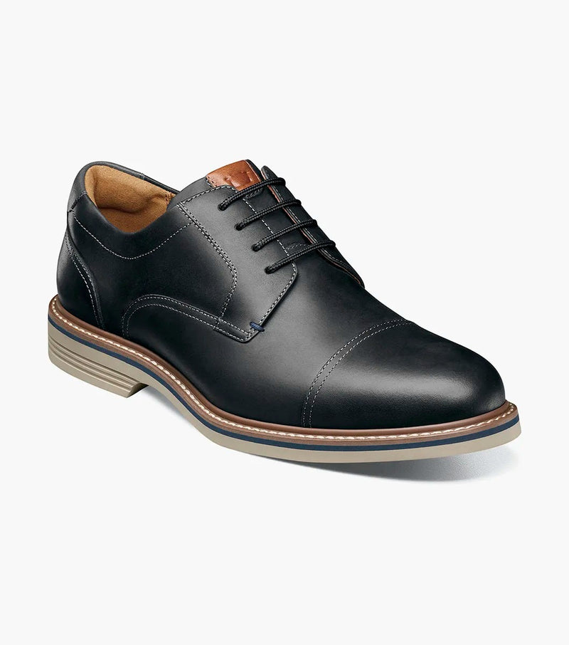 Florsheim Norwalk Cap Toe Oxford dress shoe in black leather with cap toe detail, contrast tan accents, and durable sole, angled front view.