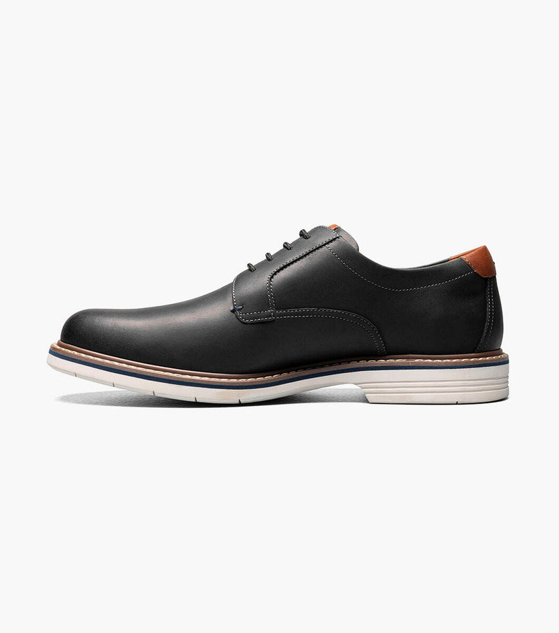 Florsheim Norwalk Plain Toe Oxford shoes in black leather with contrast tan heel accent and white sole, side view.