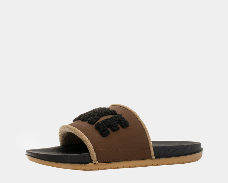 Nike Offcourt Slide SE slides in brown with fuzzy black logo detailing, soft strap lining, black footbed, and tan outsole, side view.