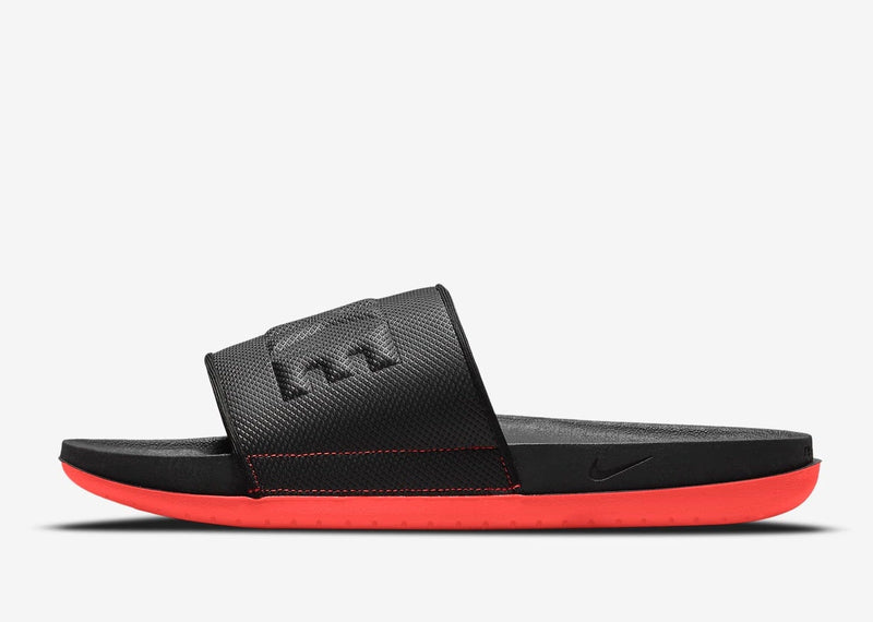 Nike Offcourt Slide sandals in black with textured strap and soft foam sole in vibrant red, side view.