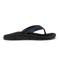 OluKai ʻOhana Pālua sandals in black with blue accents, featuring a comfortable contoured footbed and durable outsole, side view.