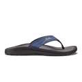 OluKai Ohana Pa'i sandals in blue camo with a black sole, featuring a water-resistant strap and anatomical footbed, side view.