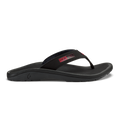OluKai ‘Ohana sandals in black with red details, featuring a durable water-resistant strap and cushioned footbed, side view.