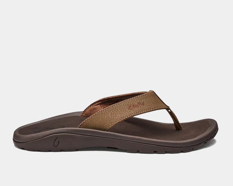 OluKai Ohana sandals in brown with water-resistant synthetic straps and cushioned footbed, side view.