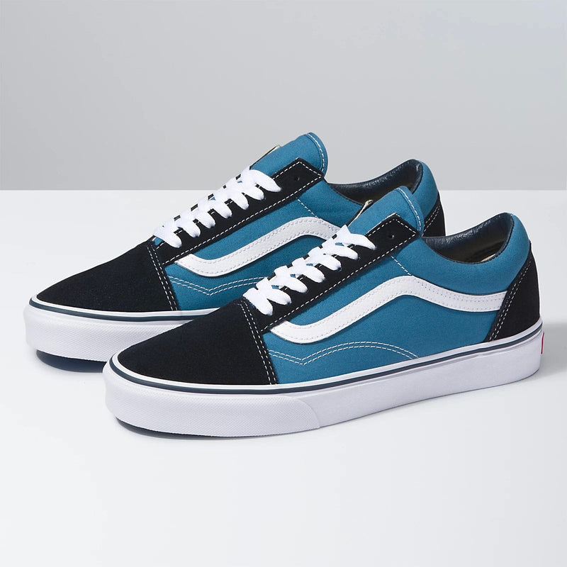 Vans Old Skool sneakers with a blue canvas upper, black suede overlays, white jazz stripe, and white rubber sole, side view.