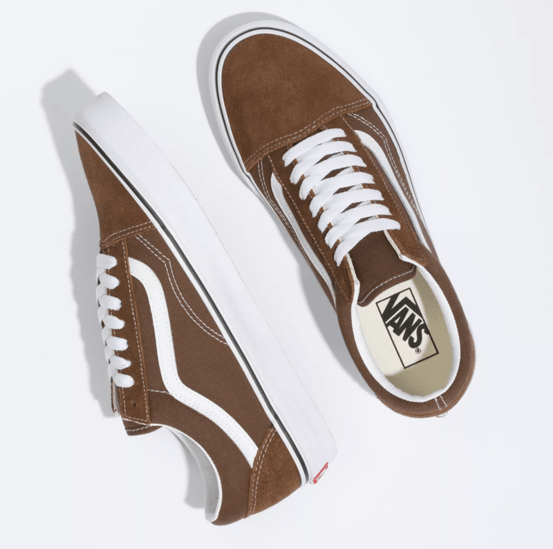 Vans Old Skool sneakers in brown with white suede and canvas upper, signature side stripe, and white rubber outsole, top view.