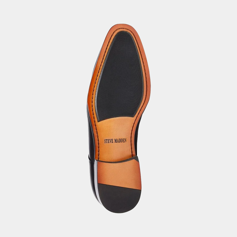 Steve Madden Parsens Leather Oxford sole view with black and tan leather outsole featuring branded detailing.