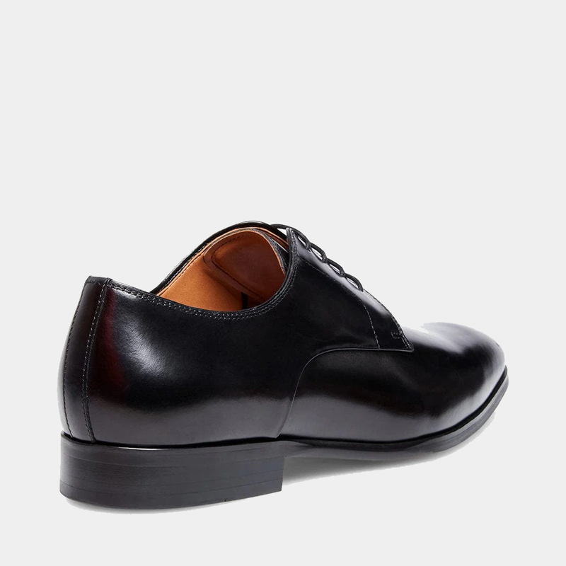 Steve Madden Parsens Leather Oxford shoes in sleek black leather with a polished finish and low stacked heel, back angle view.