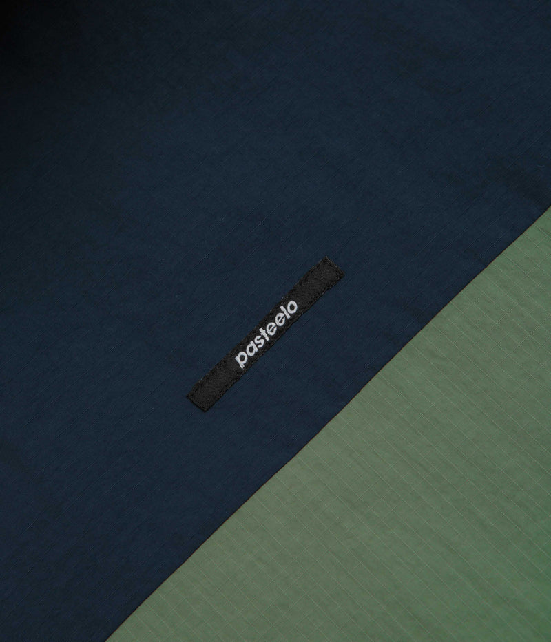 Pasteelo Hooded Windbreaker Jacket in Navy and Olive / Gold