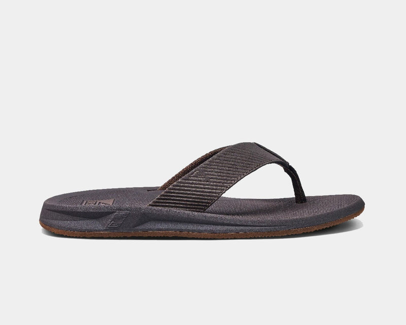 Reef Phantom II sandals in dark gray with textured straps and cushioned footbed, side view.