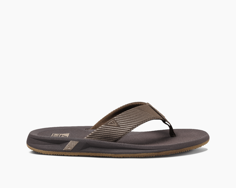 Reef Phantom II flip-flops in brown with textured synthetic straps and cushioned footbed, side view.