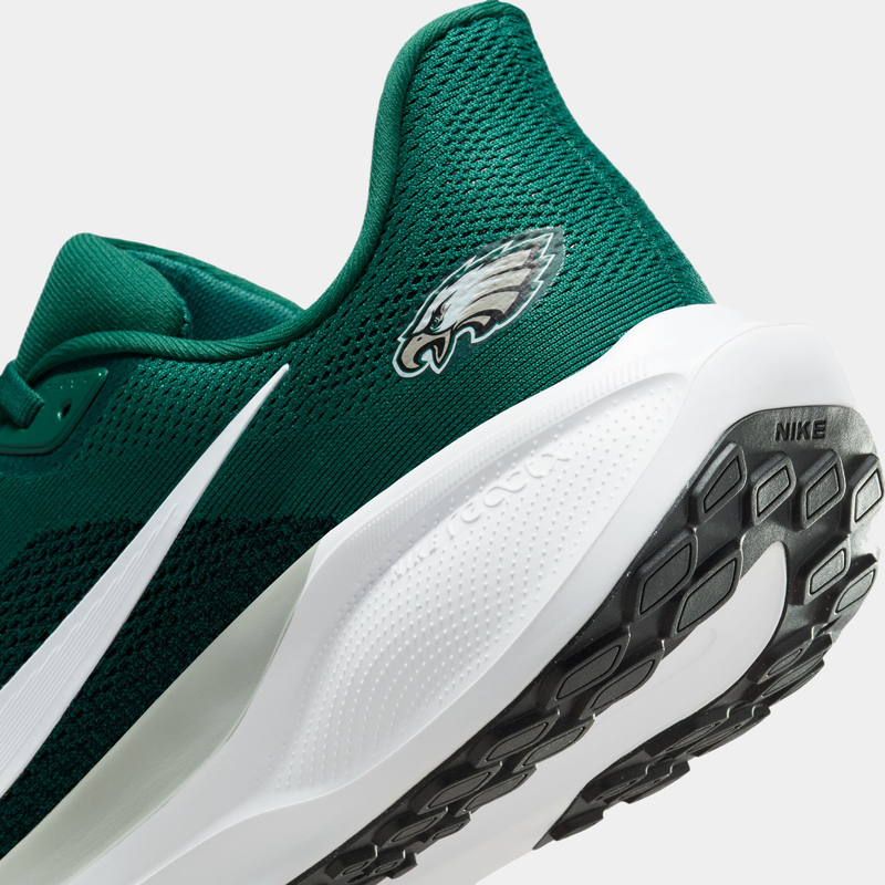 Nike Philadelphia Eagles Pegasus 41 running shoes in green with Eagles logo, React foam midsole, and black rubber outsole, side and heel close-up.