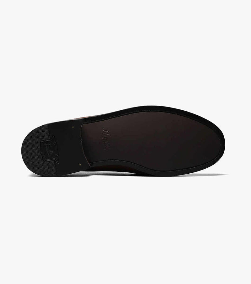 Florsheim Pisa dress shoe sole view showing sleek black leather outsole and textured heel detail.