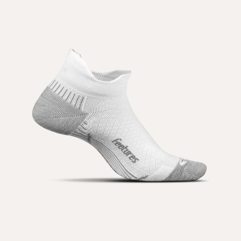Feetures Plantar Fasciitis Relief Sock Light Cushion No Show Tab in white and gray with targeted arch support and seamless design, side view.