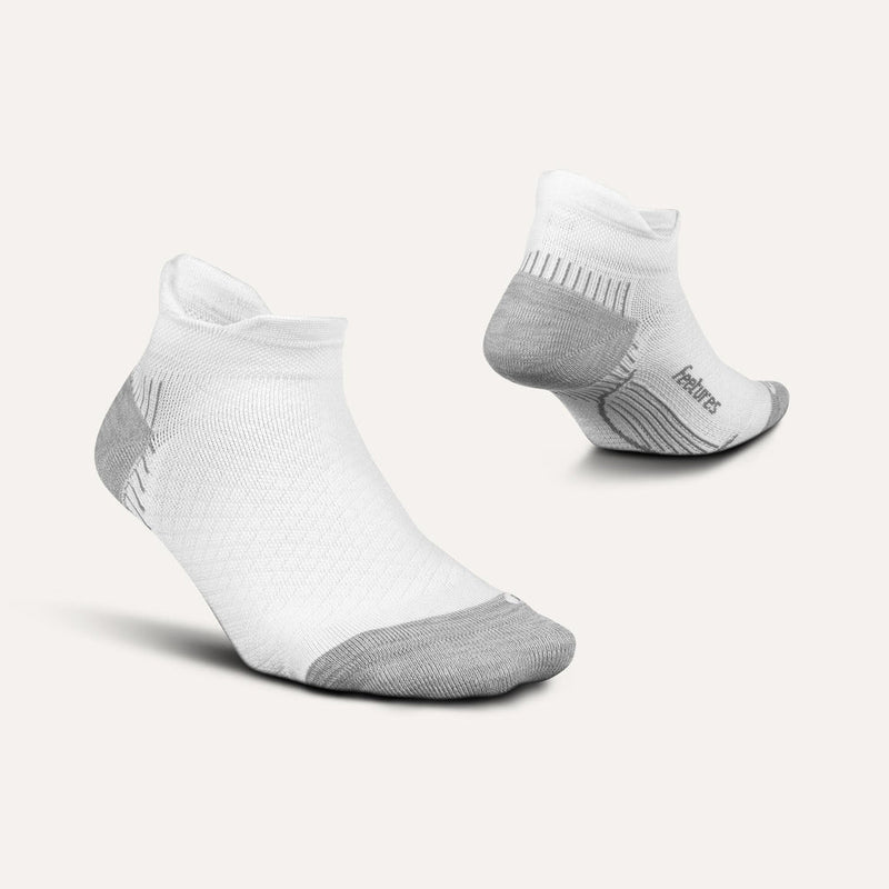 Feetures Plantar Fasciitis Relief Sock Light Cushion No Show Tab socks in white with gray heel and toe, side and back views.
