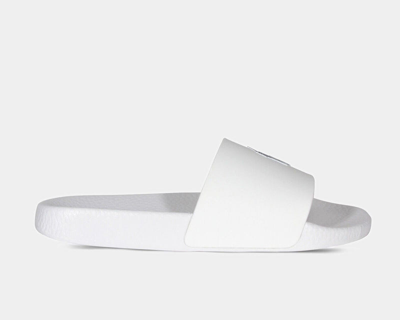 Polo Ralph Lauren Polo Signature Slide sandals in white with wide strap and textured footbed, side view.