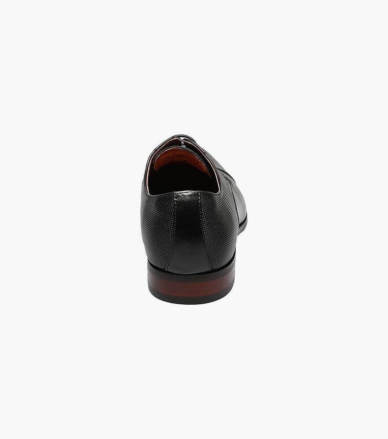 Florsheim Postino Cap Toe Oxford dress shoes, black leather with textured detail and wooden heel, back view.