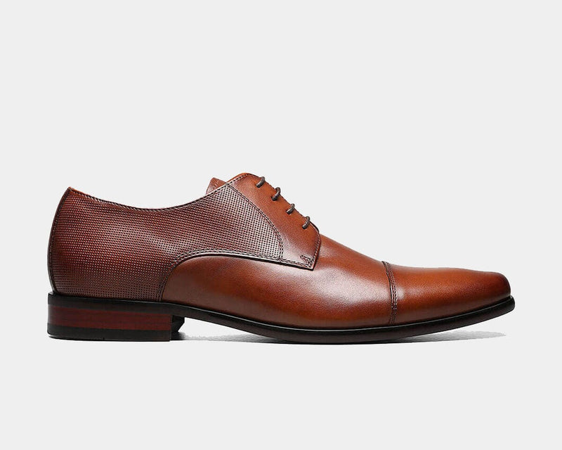 Florsheim Postino Cap Toe Oxford shoes in cognac leather with perforated accents and stacked heel, side view.
