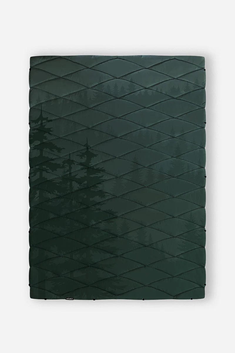 Nomadix Puffer Blanket in dark green with quilted design and subtle tree pattern, front view.