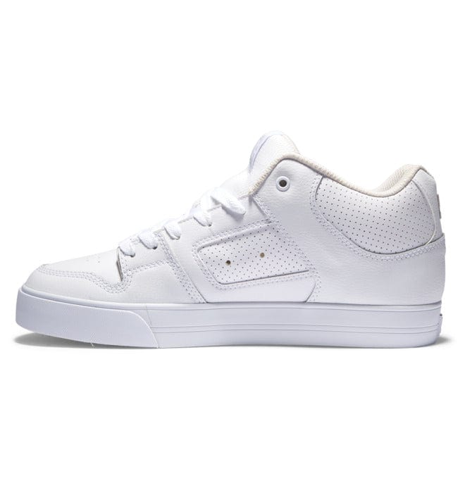 DC Footwear Pure Mid sneakers in all-white leather with perforated panels, padded collar, and lace-up design, side view.