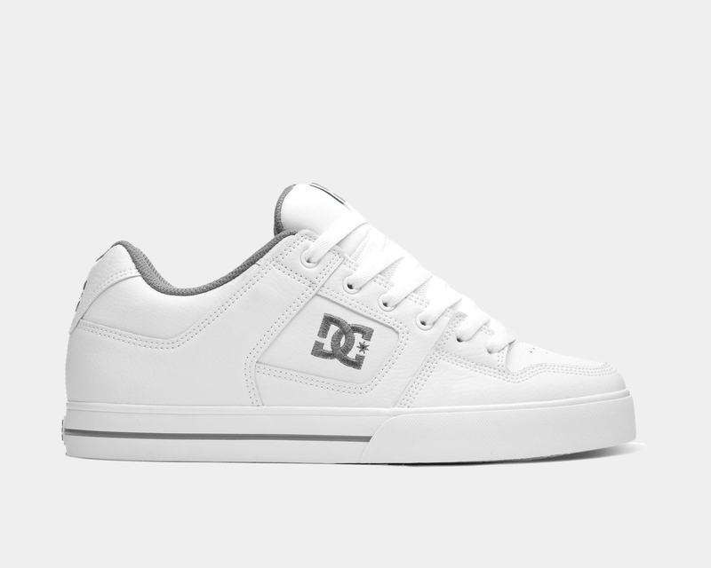DC Footwear Pure sneakers in white leather with gray accents, stitched details, lace-up closure, and side logo, side view.