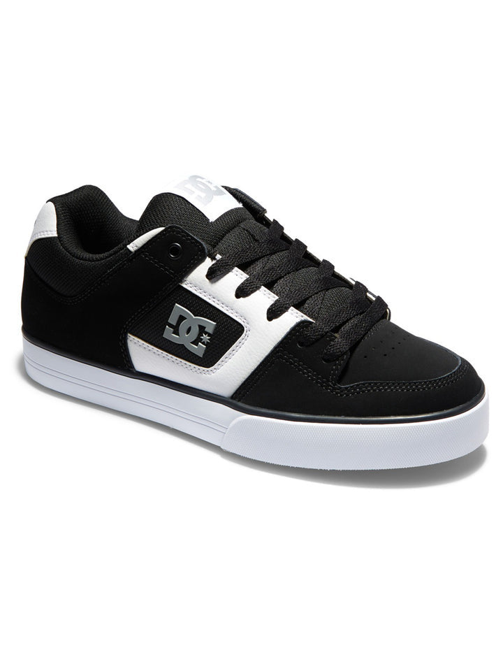 DC Footwear Pure skate shoes in black and white with padded collar, durable upper, and DC logo detailing, side angle view.