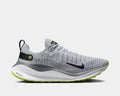 Nike React Infinity Run Flyknit 4 running shoes in gray with Flyknit upper, black Swoosh logo, and green outsole accents, side view.