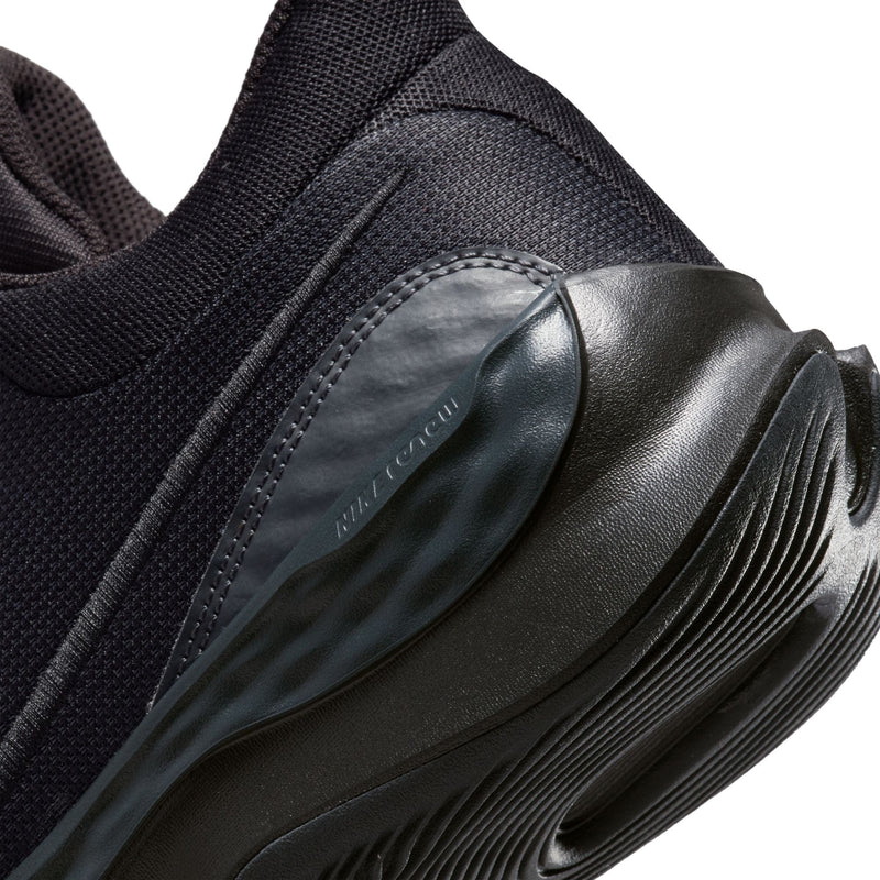 Nike Renew Elevate 3 basketball shoes, close-up of heel area showcasing textured black rubber outsole and dark mesh upper.