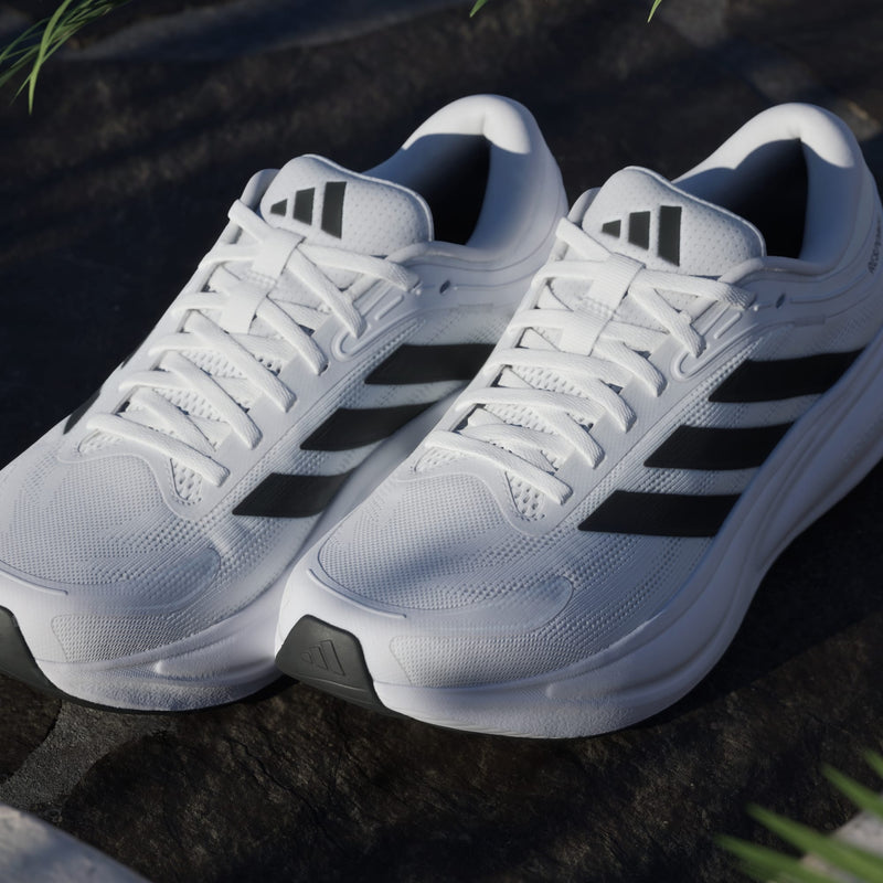 Adidas Response 2 running shoes in white with black three-stripe design, breathable mesh upper, and cushioned midsole, front angle view.