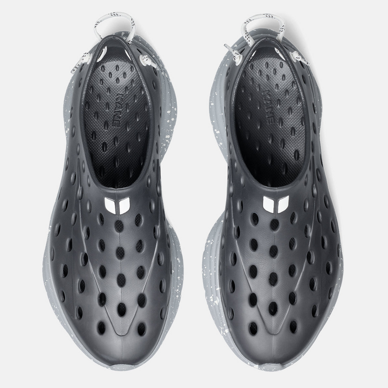 Black water shoes with clear soles on a white background