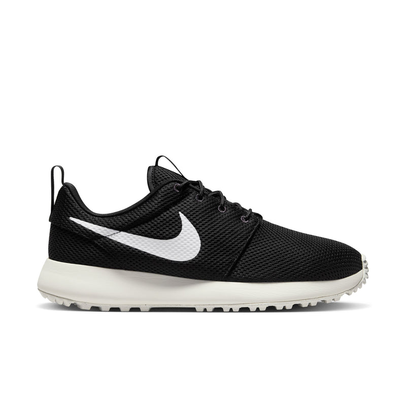 Nike Roshe Golf Next Nature golf shoes in black with a breathable mesh upper, white midsole, and Swoosh logo, side view.