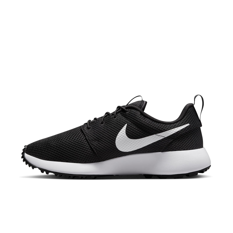 Nike Roshe Golf Next Nature golf shoes in black with white Swoosh logo, breathable mesh upper, and spikeless outsole, side view.