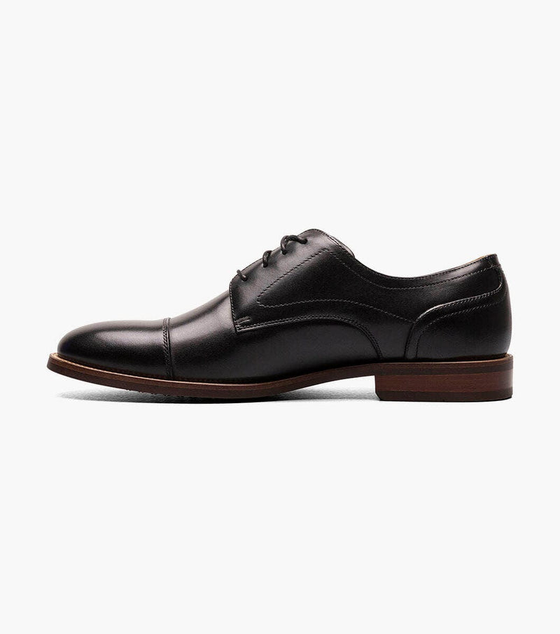 Florsheim Rucci Cap Oxford shoes in black leather with cap toe design and brown stacked heel, side view.