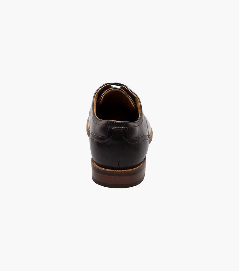 Florsheim Rucci Cap Oxford dress shoes in black leather with a brown stacked heel, back view showing heel detail.