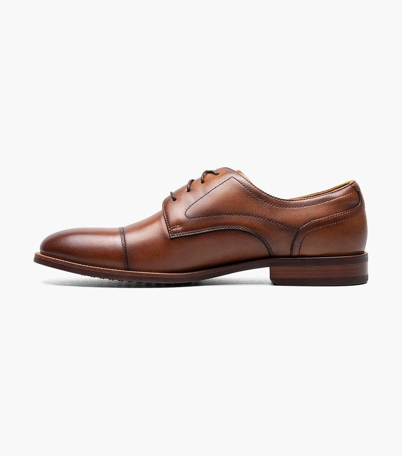 Florsheim Rucci Cap Oxford dress shoes in rich brown leather with cap toe detailing and sleek design, side view.