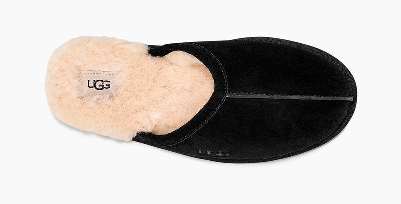 UGG Scuff slippers in black suede with plush cream sheepskin lining, top view showing logo detail.