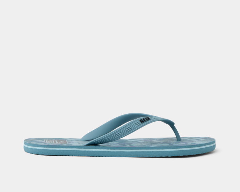 Reef Seaside Prints flip-flops in light blue with patterned footbed and textured strap, side view.