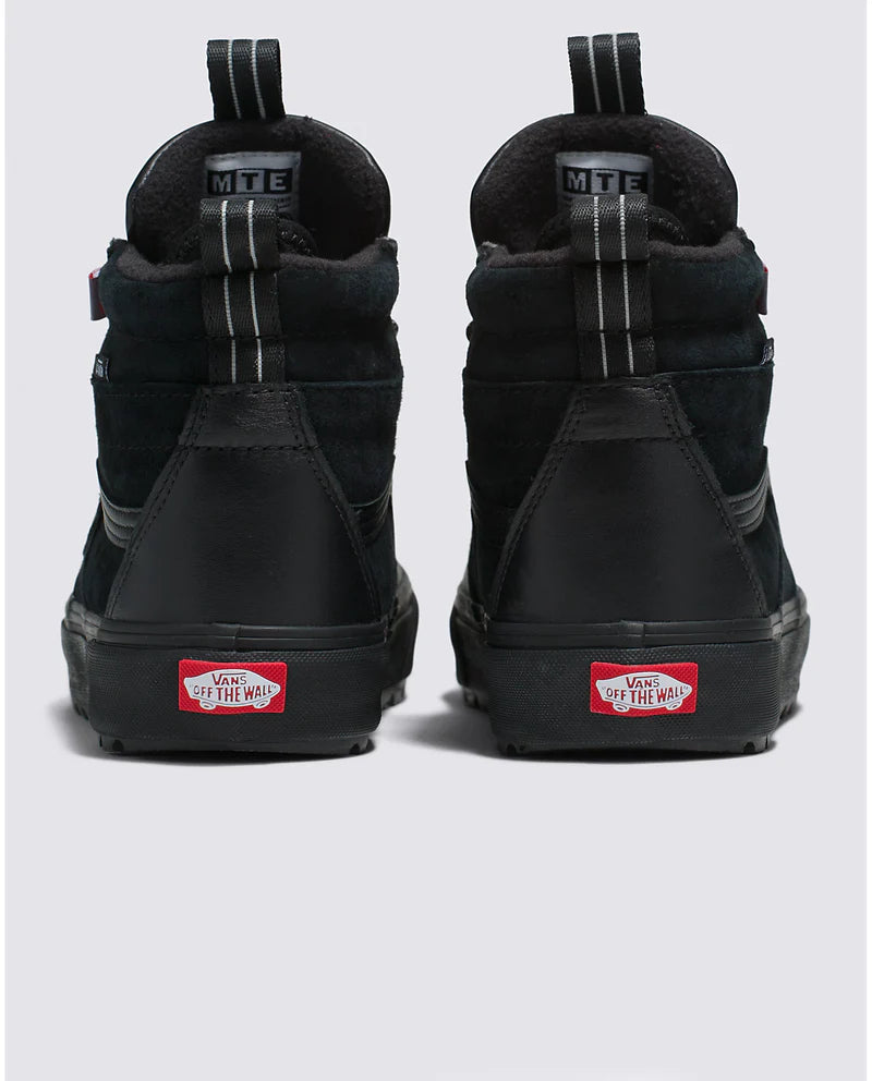 Vans Sk8-Hi MTE-2 sneakers in black suede and leather with pull tabs and "Off the Wall" logo on heel, back view.