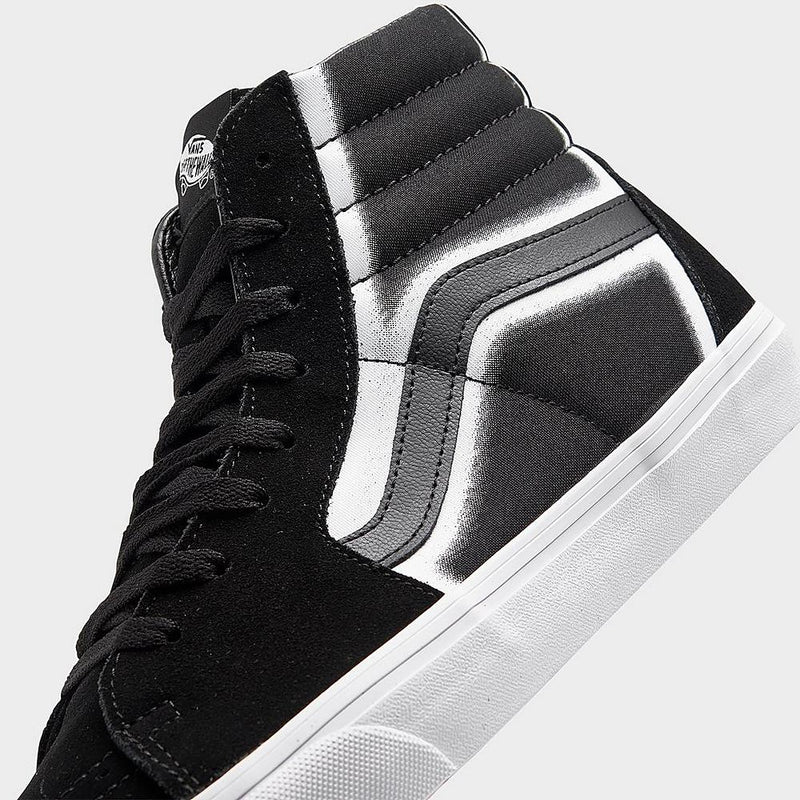 Vans Sk8-Hi sneakers in black with white and gray stripe design on canvas upper, suede overlays, and white rubber sole, side view.
