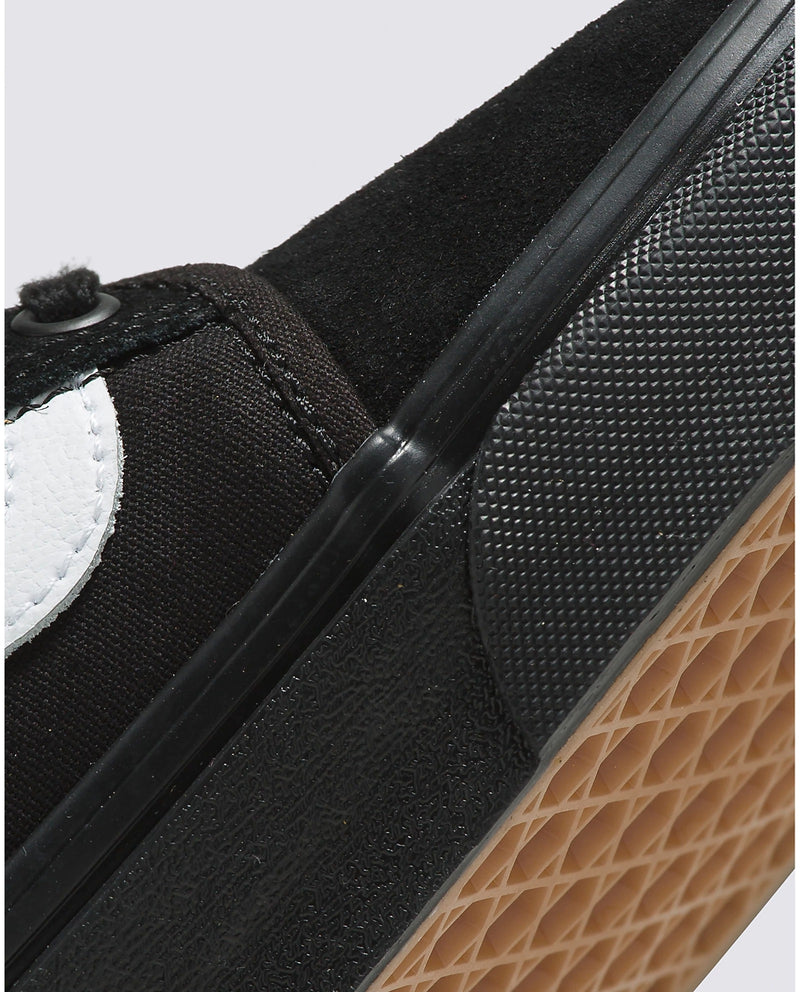 Vans Skate Chukka Low Sidestripe Core shoes in black with white sidestripe, suede and canvas materials, close-up of midsole and gum waffle outsole.