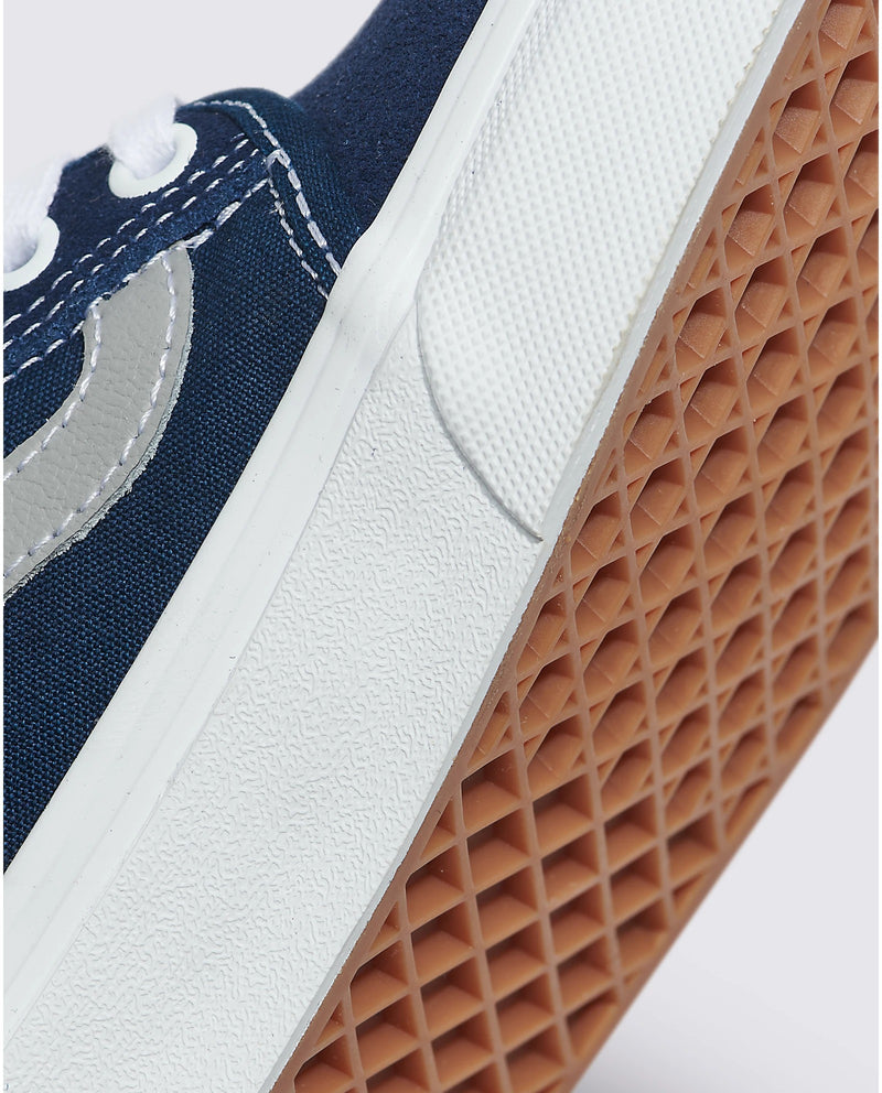 Vans Skate Chukka Low Sidestripe sneakers in navy blue with white stitching, suede and canvas upper, and gum waffle outsole, side view.