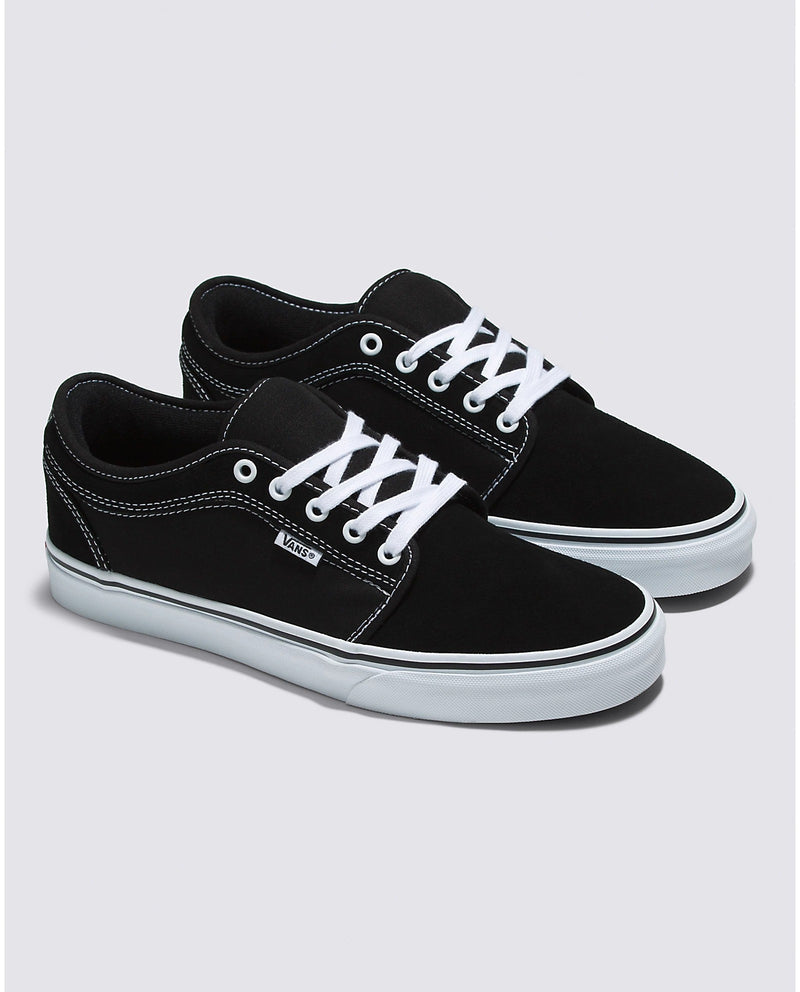 Vans Skate Chukka Low skate shoes in black suede with white stitching and laces, side and angled view